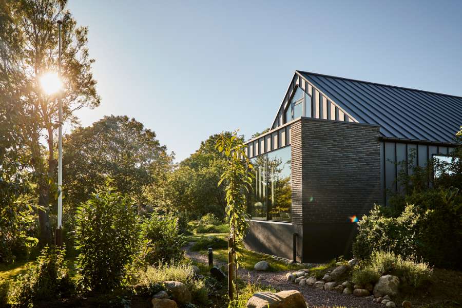 “Royal” door, found in Christiania, now installed in a steel façade, Volstrupvej 63, 9240 Nibe